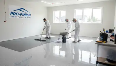 Epoxy floor coating in Reading MA garage by professional house painters, durable and chemical-resistant finish