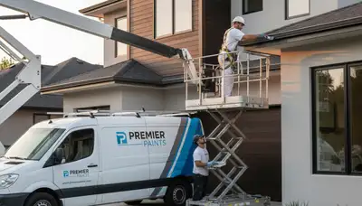 Professional gutter painting on a home exterior in Reading, MA by expert house painters